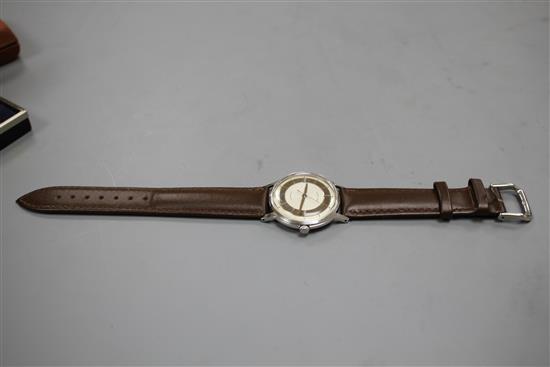 A gentlemans 1960s stainless steel Hamilton automatic wrist watch, with baton numerals and later associated leather strap,